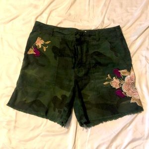 Free People camo cutoff shorts.